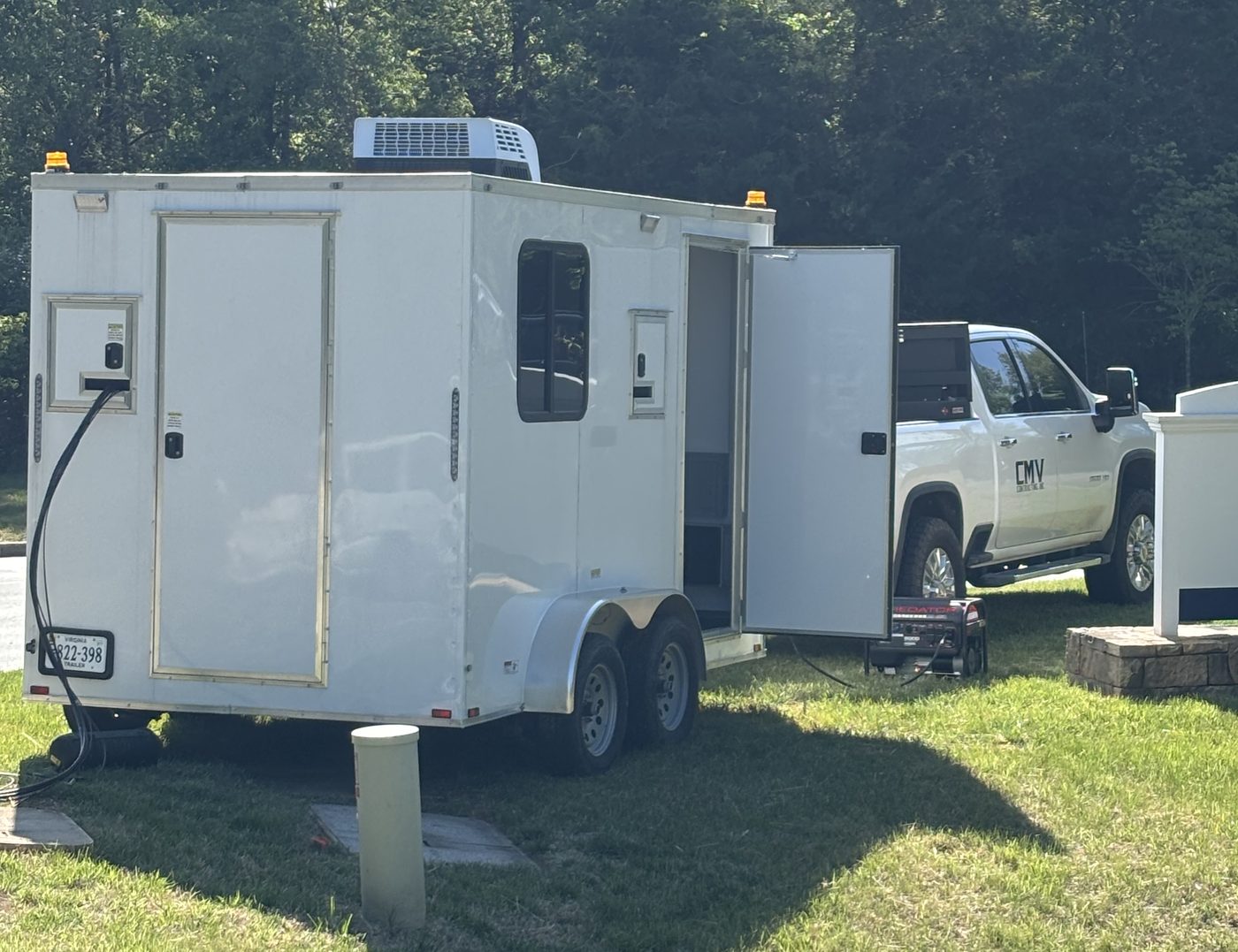 CMV splice trailer set up on site with a CMV Contracting truck alongside